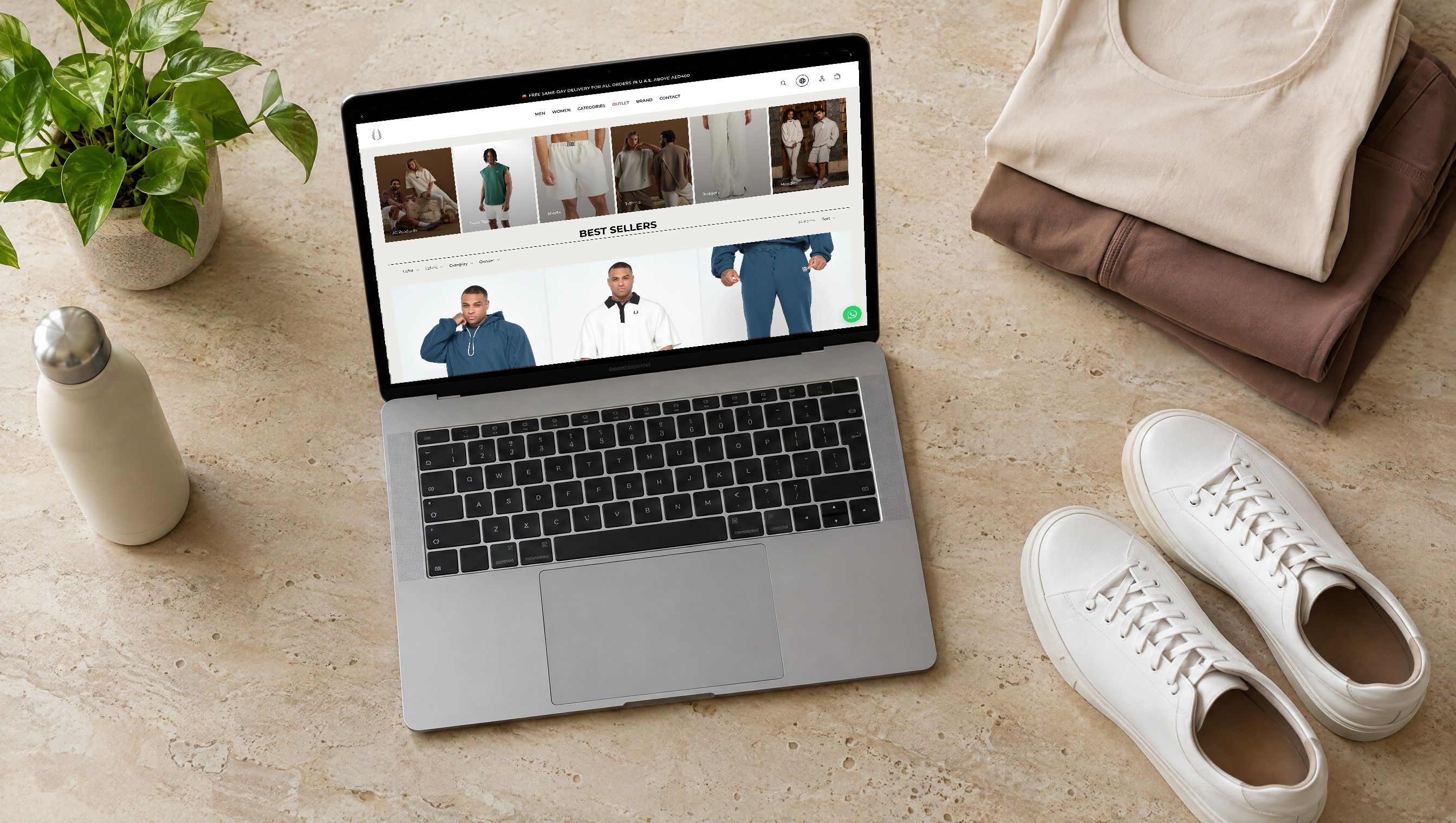 The EGO Sustainable best sellers page on a laptop beside folded athleisure and sneakers