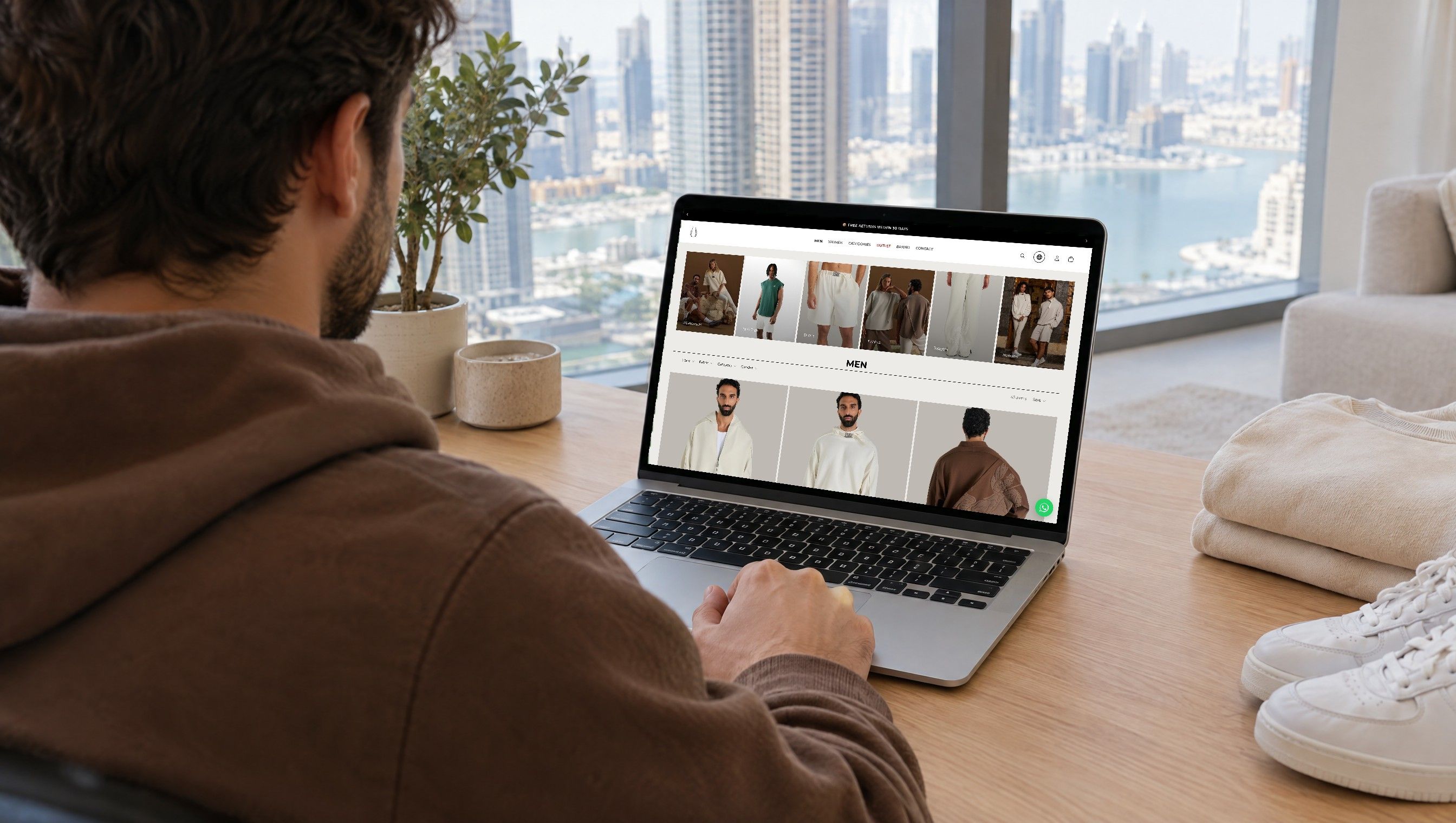The EGO Sustainable men's collection open on a laptop at home